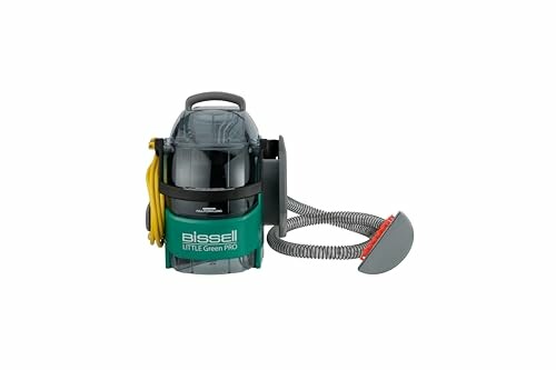 Bissell Little Green Pro vacuum cleaner with hose attachment.