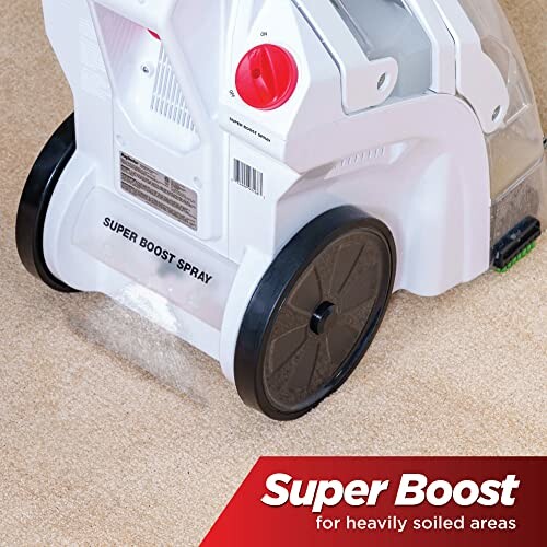 Carpet cleaner using super boost spray on carpet.