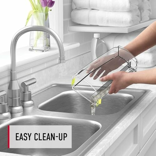 Person cleaning clear container over kitchen sink with faucet.