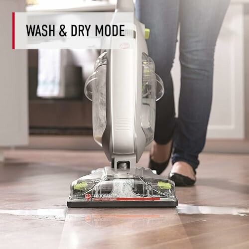 Person using a floor cleaner in wash and dry mode.