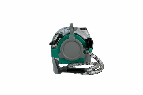 Portable carpet cleaner with hose attachment.