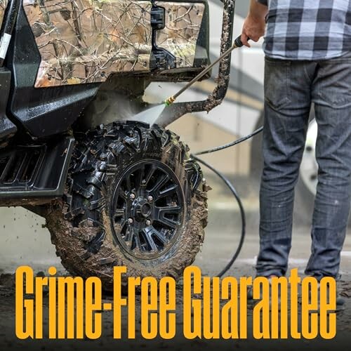 Person pressure washing muddy ATV tire with text 'Grime-Free Guarantee'.