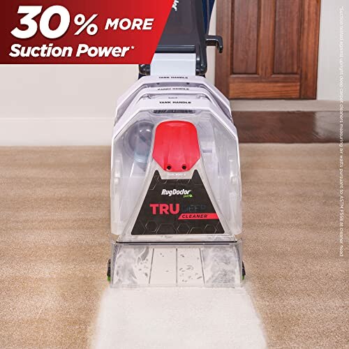 Carpet cleaner demonstrating 30% more suction power.